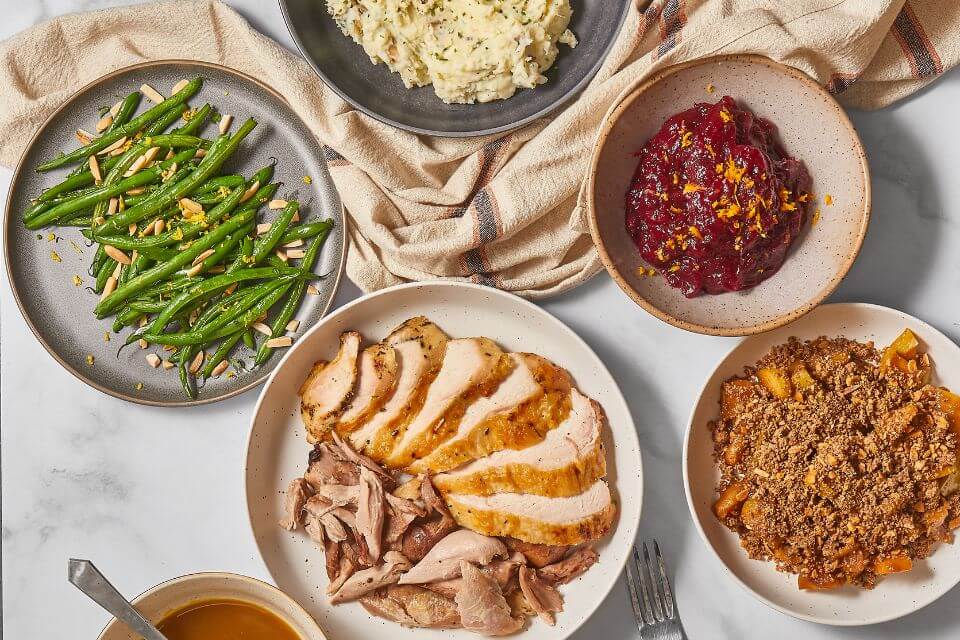 Azuluna Foods thanksgiving spread in a staged photo on marble counters, taken from above