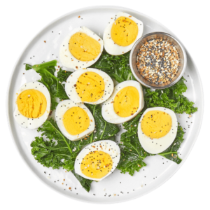 Azuluna Foods hard boiled eggs on a plate in a staged photo. The photo has no background.